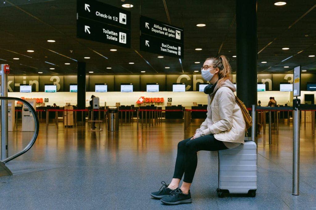 woman-wearing-mask-waits-at-the-airport-during-pandemic