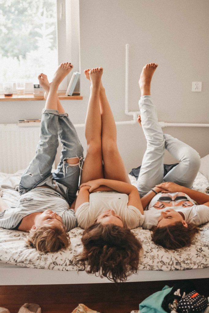 three-women-in-bed-with-their-feet-up-self-confidence